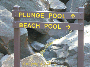 The sign to direct you to either the plunge pool or the beach pool